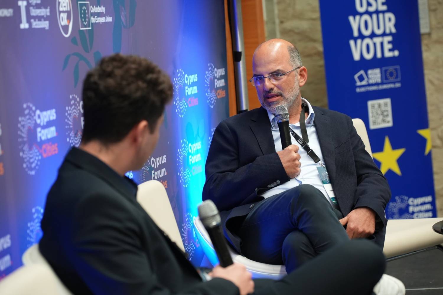 Yiannis Armeftis, an architect and candidate for Limassol mayor, discussed his vision for the city's future and his commitment to local government reform at a panel discussion