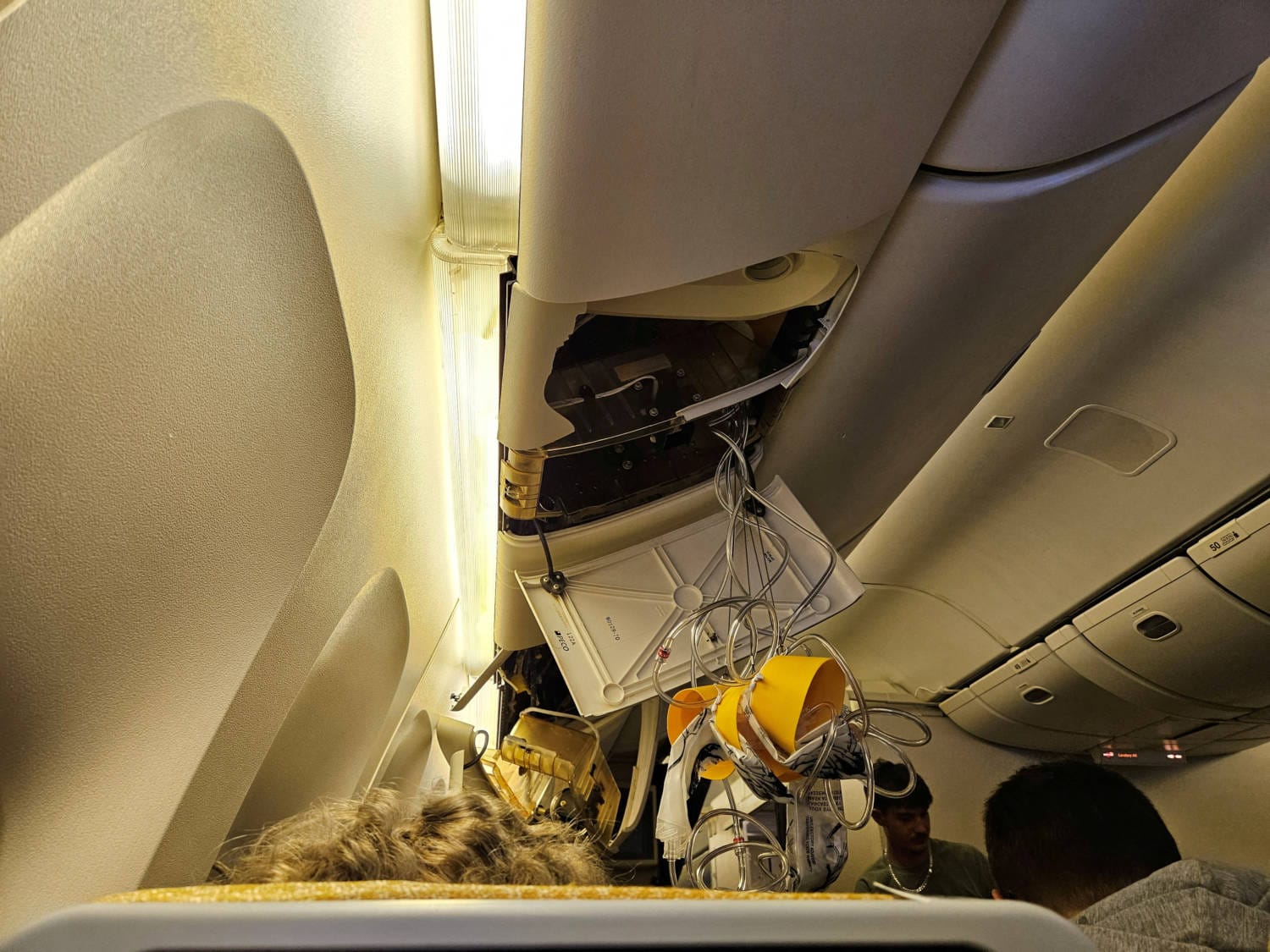 One passenger died from a suspected heart attack and 30 others were injured when a Singapore Airlines flight from London to Singapore encountered severe turbulence, prompting the plane to divert to Bangkok.